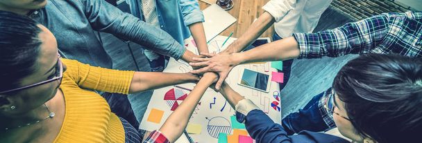 Top view of Group Of Asian and Multiethnic Business people making pile of hands in the modern office, people business team work group concept, Banner and web page or cover template  - Photo, image