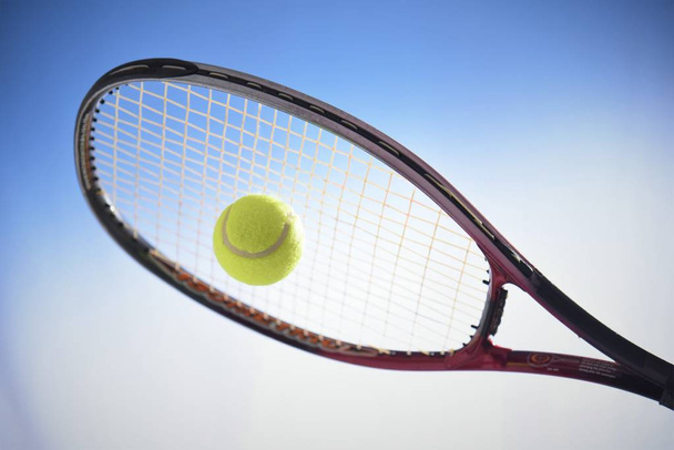 tennis ball with racket isolated black background;studio shooting - Fotoğraf, Görsel