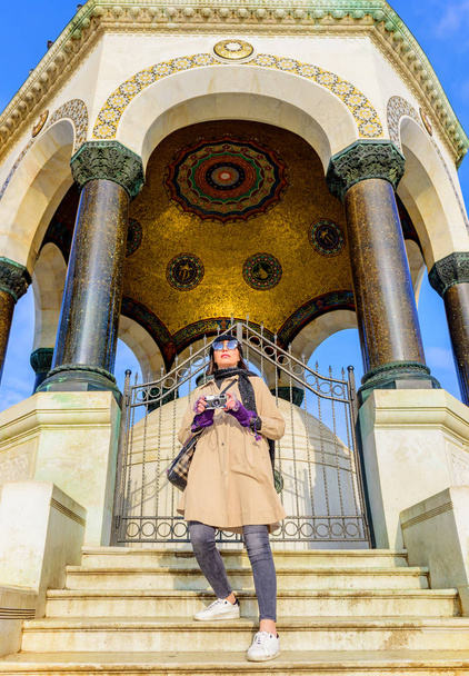 Beautiful woman traveler tourist take pictures  at ancient building at Sultanahmet park popular destination for Tourists and locals in Istanbul,Turke - 写真・画像
