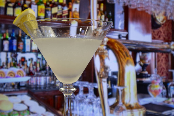 Kamikaze cocktail in martini glass decoreted slice of lemon - Photo, Image