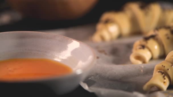 Raw croissant with ingredients on a kitchen countertop. - Felvétel, videó
