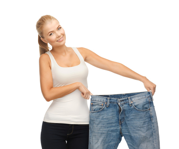 Sporty woman showing big pants - Photo, image