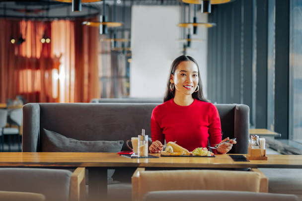 Wife waiting for her husband while eating breakfast in restaurant - Фото, изображение