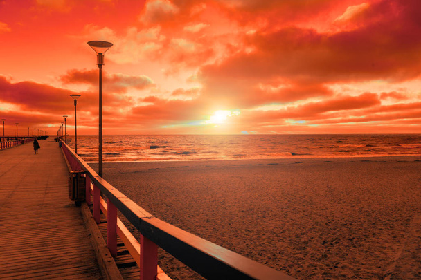View of wooden pier over sea. Palanga city at sunset in autumn, Lithuania - Photo, Image