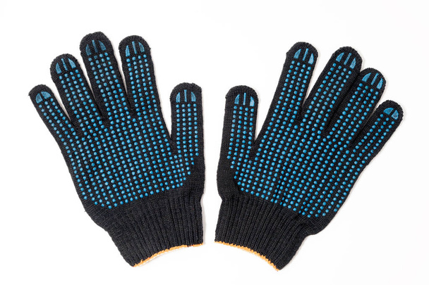 Крупный план пара черных текстильных вязаных перчаток с профессиональным б
 - Фото, изображение