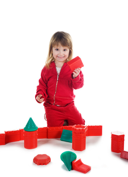 Little girl with red blocks - Фото, изображение