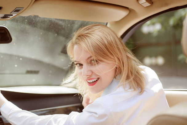 Traveling with pleasure. Pretty girl travel by automobile transport. Traveling by road transport. Sexy woman enjoy road trip. Eco friendly sustainable travel. Eco driving is an ecologic driving style - 写真・画像