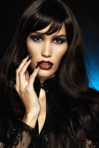 beautiful young vampire woman. black hair sexy Halloween make-up Girl - Fotografie, Obrázek