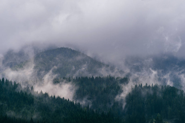 scenic view of storm rainy clouds over mountain hills - Fotó, kép
