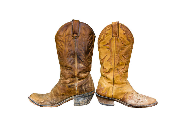 pair of worn cowboy boots brown and yellow isolate against white background - Foto, Imagen