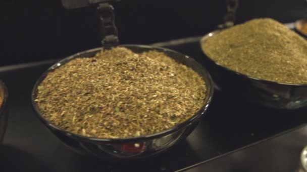 Spices in bowls.Department with spices in the store. Ground cardamom, ground ginger, whole nutmeg, spice pepper, cumin zira, cayenne pepper, hops-suneli. - Footage, Video