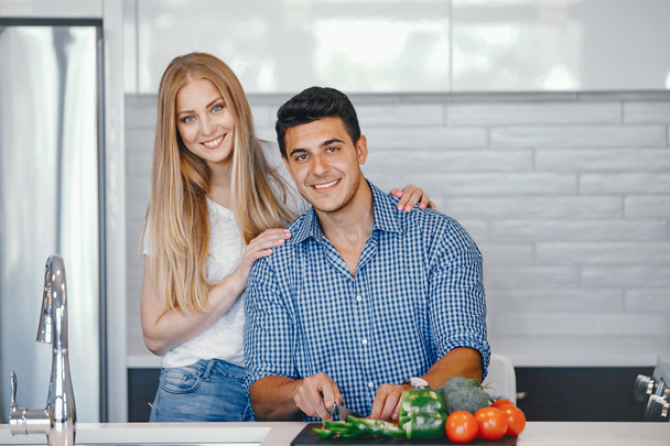 couple at home in a kitchen - Фото, зображення