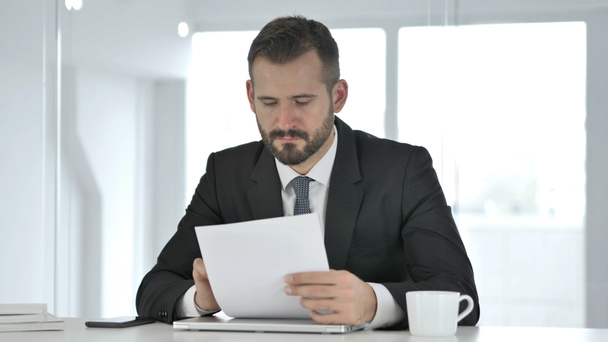 Businessman Reading Documents, Paperwork - Photo, image