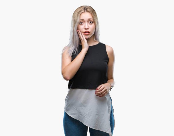 Young blonde woman over isolated background thinking looking tired and bored with depression problems with crossed arms. - Foto, afbeelding