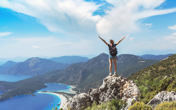 Hiker girl on the mountain top, oncept of freedom, victory, active lifestyle - Φωτογραφία, εικόνα