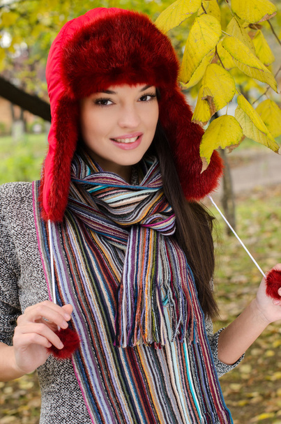 Sexy young brunette girl in autumn scene. - Zdjęcie, obraz