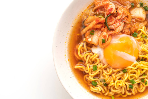 Korean instant noodles with kimchi and egg isolated on white background - 写真・画像