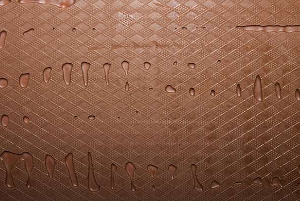 Texture of milk chocolate with patterns.Background chocolate top view. - Foto, Imagem