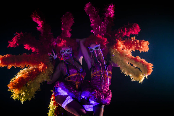 beautiful young can-can dancers with pom-poms dancing together in carnival concept - Foto, immagini