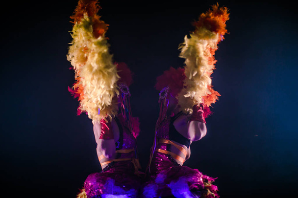 beautiful young can-can dancers with pom-poms dancing together in carnival concept - Foto, Imagem