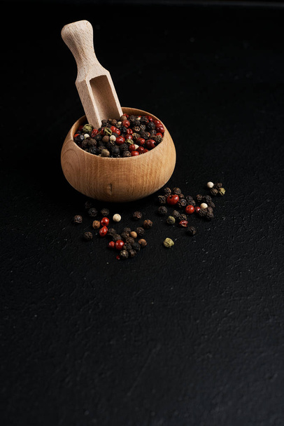 studio sho of food composition with black pepper on table - Fotó, kép