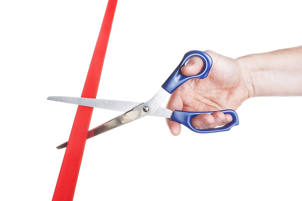Man's hand cut red tape scissors. Business concept. - Photo, Image