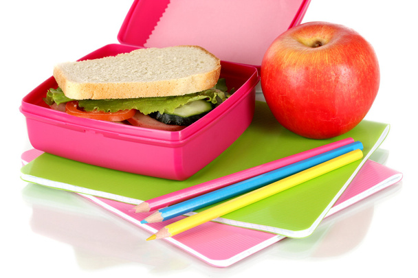 Lunch box with sandwich,apple and stationery isolated on white - Photo, Image