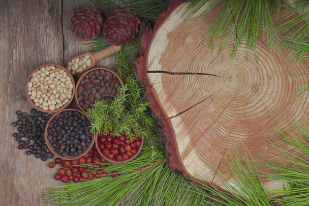 Closeup of assorted berries and herbs on wooden background - Zdjęcie, obraz