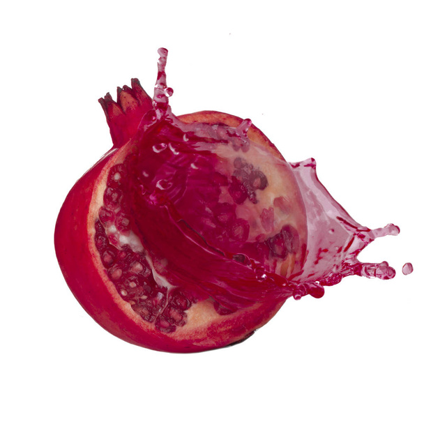 Closeup of pomegranate isolated on white background  - 写真・画像