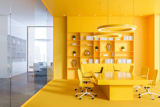 Interior of office conference room with yellow walls and floor, long table with yellow chairs and yellow bookcase. 3d rendering - Fotografie, Obrázek