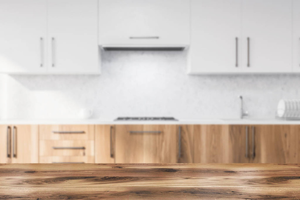Interior of modern kitchen with concrete walls, wooden countertops with built in sink and cooker and white cupboards. 3d rendering blurred - Valokuva, kuva