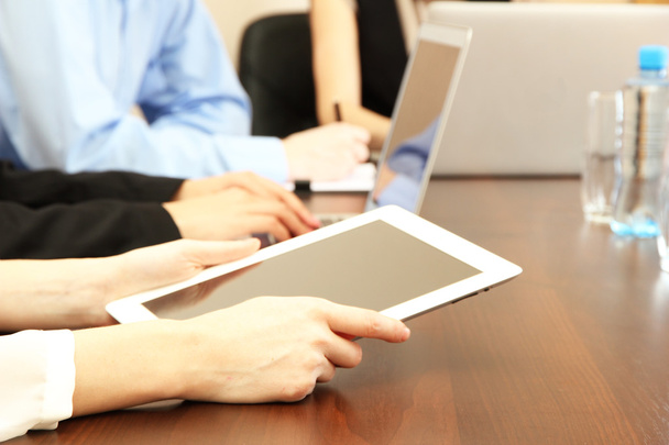 Female hands with digital tablet on office background. - Foto, Imagem