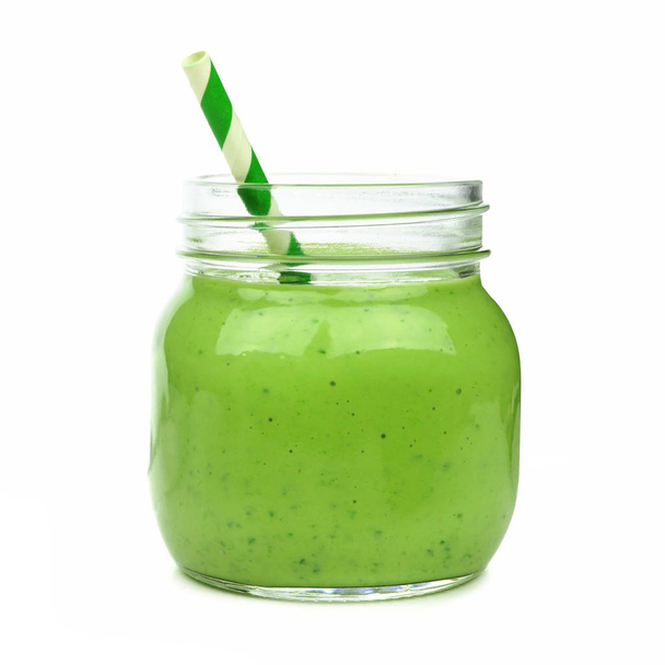 Green smoothie in a mason jar with paper straw isolated on a white background - Foto, immagini