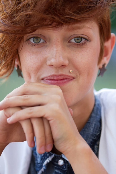 Fashionable teenage hipster girl with lip ring piercing  posing.  - Foto, afbeelding