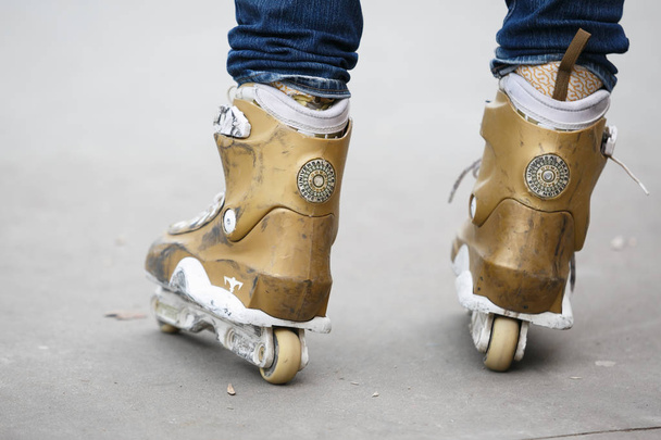 MOSCOW - 25 MARCH,2017: Aggressive inline roller skates for extreme skating in skatepark. Specialized in-line roller boots made to grind rails,ledges & jump in the air on ramps - Фото, зображення