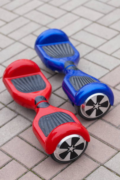 Modern transportation technology - electric mini segway or scooter hover board. Trending new gadget that became very popular among youth and adults. This is the future of energy effetive personal urban transport that produces no pollution to the atmo - Photo, Image