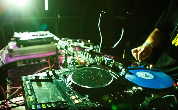 KIEV-4 JULY,2018: Professional dj cd player device on stage in night club. Pioneer digital turn table for disc jockey - Foto, Imagem