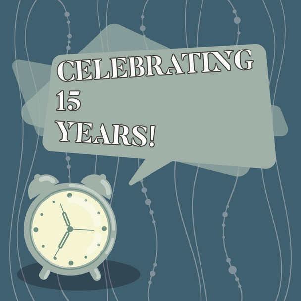 Handwriting text Celebrating 15 Years. Concept meaning Commemorating a special day after 15 years anniversary Blank Rectangular Color Speech Bubble Overlay and Analog Alarm Clock. - Photo, Image