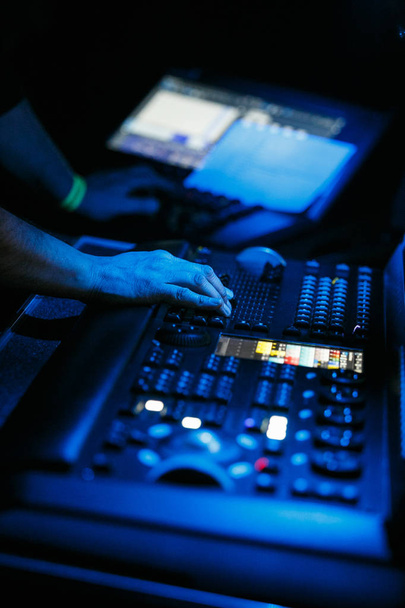MOSCOW - 3 DECEMBER, 2016: Sound technician and lights technicians control the music show in night club. - Foto, imagen