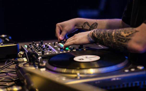 MOSCOW - 20 OCTOBER,2016: DJ play music show on concert in night club on stage.Nightclub party,disc jockey mix music. - Φωτογραφία, εικόνα