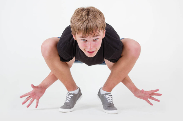  Teenager bboy training on white background - Foto, Imagen