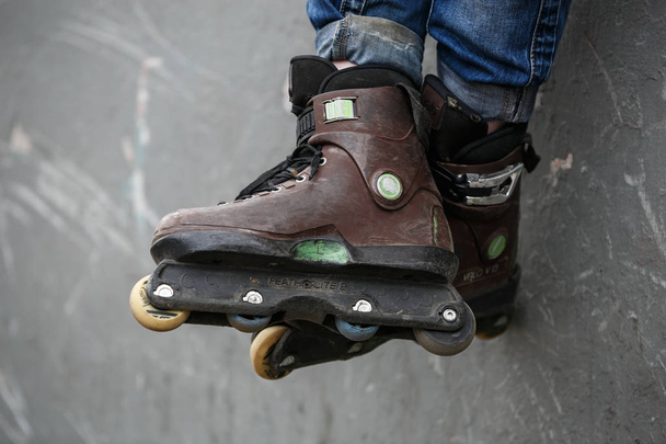 MOSCOW - 25 MARCH,2017: Aggressive inline roller skates for extreme skating in skatepark. Specialized in-line roller boots made to grind rails,ledges & jump in the air on ramps - Photo, image