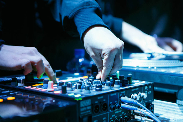 MOSCOW - 15 NOVEMBER,2016: Professional DJ digital turntable.Play music in the club on Rane player.Hands of disc jockey mix tracks on sound mixer.Close up,performing arts show - Foto, Bild