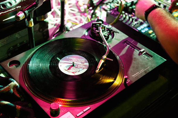 KIEV-4 JULY,2018: Retro dj Technics turntables with vinyl records on concert stage in music hall.Professional disc jockey audio equipment on electronic festival in nightclub - Zdjęcie, obraz
