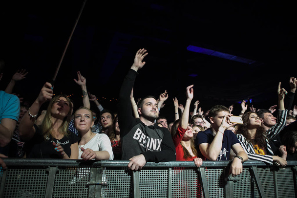 MOSCOW-10 JUNE, 2016: Music fans listening to singer Assai on stage in night club. Russian hip hop concert audience   - Zdjęcie, obraz