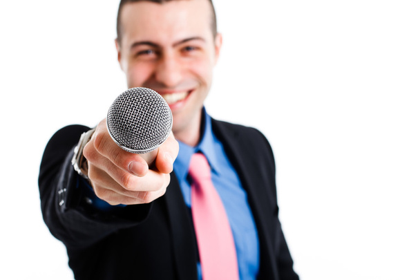 Man holding a microphone - Foto, afbeelding