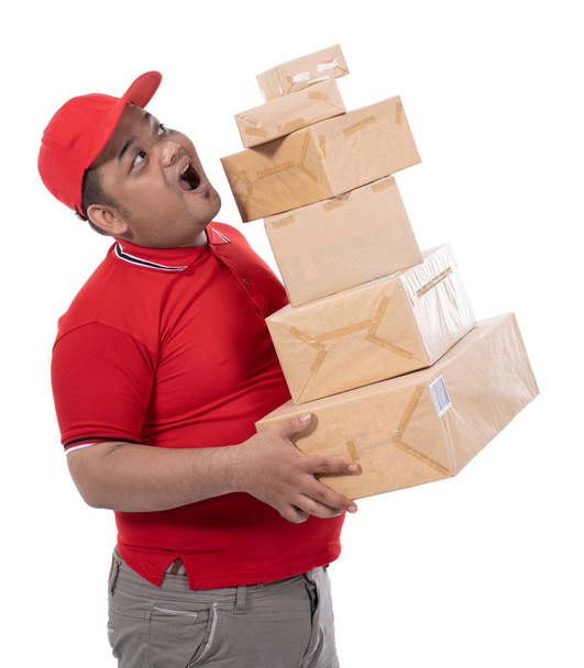 portrait of side view delivery man struggling to lift many boxes - Photo, Image