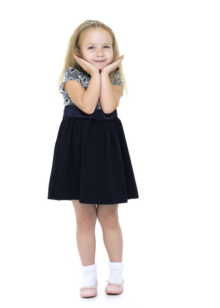 Little girl posing in studio on a white background. - 写真・画像