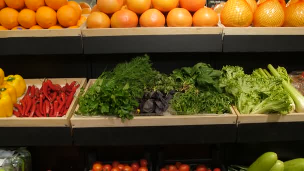 Fresh vegetables and fruit on shelf in supermarket - Footage, Video