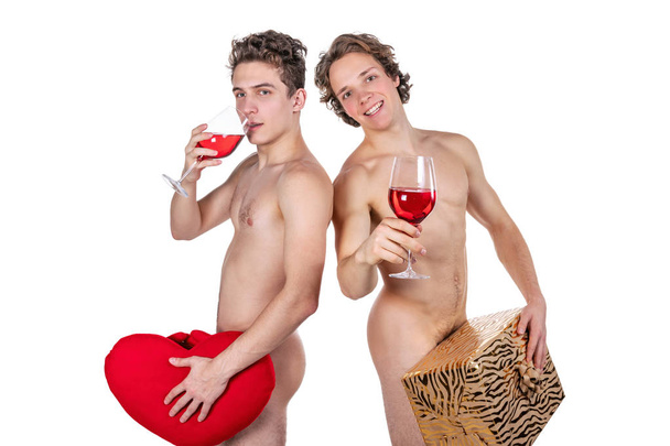 Two funny naked guys holding glasses with red wine and heart isolated on white - Foto, Imagen